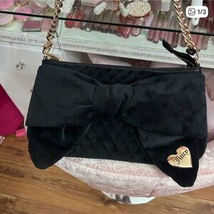 juicy couture, licorice tied with a bow shoulder bag